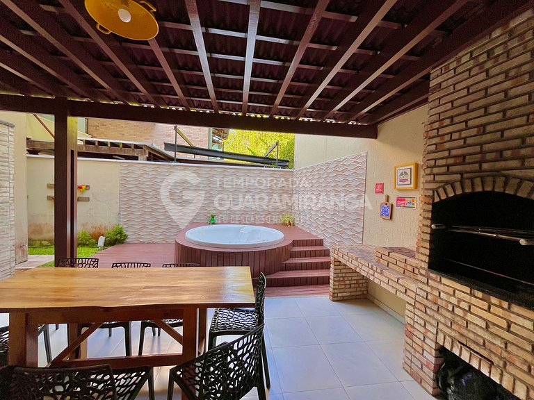 Triplex house with 4 bedrooms and a hot tub in the center of